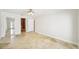 Bright main bedroom features tile flooring and ensuite bathroom and closet entries at 6212 N Grady Ave, Tampa, FL 33614