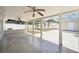 Spacious covered patio with ceiling fans and concrete flooring overlooking the backyard at 6212 N Grady Ave, Tampa, FL 33614