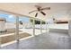 Spacious covered patio with ceiling fans and concrete flooring, ideal for outdoor entertaining at 6212 N Grady Ave, Tampa, FL 33614