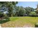 Wide shot of the backyard highlighting the size of the yard with natural surroundings at 6226 Florence St, Gibsonton, FL 33534