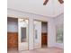 Neutral bedroom with a ceiling fan and closet with mirrored doors at 6226 Florence St, Gibsonton, FL 33534