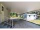 The steps, carport, and outbuilding provide convenience and functionality at 6226 Florence St, Gibsonton, FL 33534