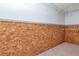 A unique closet with wooden walls and carpeted flooring at 6226 Florence St, Gibsonton, FL 33534