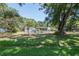 Charming home featuring a screened-in porch and a spacious yard with mature trees at 6226 Florence St, Gibsonton, FL 33534