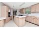 Kitchen with lots of wood cabinets, white countertops and center island at 6226 Florence St, Gibsonton, FL 33534