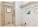 Functional laundry room with shelving, an exterior door, and convenient utility connections at 6226 Florence St, Gibsonton, FL 33534