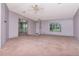 Open living room with ceiling fan at 6226 Florence St, Gibsonton, FL 33534