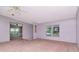 Living room with windows and ceiling fan at 6226 Florence St, Gibsonton, FL 33534