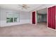 Cozy living room with large windows and light carpet at 6226 Florence St, Gibsonton, FL 33534