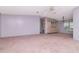 Open living room with a ceiling fan and built in cabinet at 6226 Florence St, Gibsonton, FL 33534