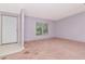 Bright room with large windows and white front door at 6226 Florence St, Gibsonton, FL 33534
