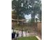 Fenced backyard with string lights, plants, and patio area at 6741 4Th Ave N, St Petersburg, FL 33710