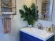 Stylish bathroom vanity features a vibrant blue cabinet and modern fixtures at 6741 4Th Ave N, St Petersburg, FL 33710