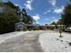 Quaint one-story home features a circular driveway and well maintained landscaping at 6741 4Th Ave N, St Petersburg, FL 33710
