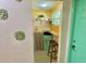 View of kitchenette with small refrigerator and a stool at 6741 4Th Ave N, St Petersburg, FL 33710