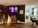 Stylish living room featuring dark accent walls, surf decor, and an open floor plan at 6741 4Th Ave N, St Petersburg, FL 33710