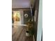 Cozy living area with dark accent walls, plants, and an open entryway at 6741 4Th Ave N, St Petersburg, FL 33710
