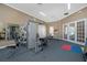 Community gym featuring weight-lifting and fitness equipment, ample lighting, and a ceiling fan at 7001 Interbay Blvd # 242, Tampa, FL 33616