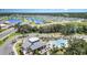 Aerial view of the community clubhouse and pool area, showcasing picturesque landscaping and recreational amenities at 7119 Amelia River Dr, Parrish, FL 34219
