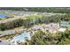 Scenic aerial view of the community featuring a pool, lake, playgrounds, green spaces and inviting landscaping at 7119 Amelia River Dr, Parrish, FL 34219