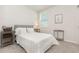 Cozy bedroom features a comfortable bed with plush pillows and neutral decor with ample natural light at 7119 Amelia River Dr, Parrish, FL 34219