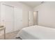 Bright bedroom boasts a closet, simple design, and soft carpet, with natural light streaming through the window at 7119 Amelia River Dr, Parrish, FL 34219
