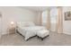 Bright bedroom featuring neutral color palette, carpet flooring, and natural light from large windows at 7119 Amelia River Dr, Parrish, FL 34219