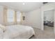 Bedroom featuring neutral color palette, carpet flooring, and natural light from large windows at 7119 Amelia River Dr, Parrish, FL 34219