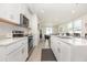 Modern kitchen features stainless steel appliances, granite countertops, and an open concept layout at 7119 Amelia River Dr, Parrish, FL 34219
