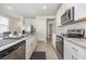 Bright kitchen showcases stainless steel appliances, granite countertops and a clean, modern design at 7119 Amelia River Dr, Parrish, FL 34219