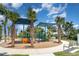 A vibrant playground, shaded by mature palms, offers a fun space for to play at 7119 Amelia River Dr, Parrish, FL 34219
