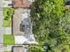 An aerial view of the property showcasing the roof, landscaping, and large backyard at 7137 Wedgewood Dr, New Port Richey, FL 34652