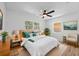 Stylishly staged bedroom boasts natural lighting, ceiling fan, and carpeted floors at 7137 Wedgewood Dr, New Port Richey, FL 34652