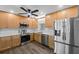 Updated kitchen with stainless steel appliances, light wood cabinets, and marble countertops at 7137 Wedgewood Dr, New Port Richey, FL 34652