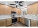 Modern kitchen features stainless steel appliances, light wood cabinets and bright, marble countertops at 7137 Wedgewood Dr, New Port Richey, FL 34652