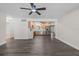 Spacious living room offers ample room and showcases an open floor plan into kitchen at 7137 Wedgewood Dr, New Port Richey, FL 34652