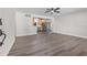 Bright room featuring grey flooring, light walls, and recessed lighting throughout the space at 7137 Wedgewood Dr, New Port Richey, FL 34652