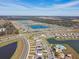 Wide aerial view showcasing several community lakes, pools, and residential areas at 7380 Sail Clover Ln, Zephyrhills, FL 33540