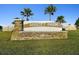 Close-up of the stone Abbott Park community sign and landscaping at 7380 Sail Clover Ln, Zephyrhills, FL 33540