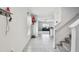 Bright entryway showcasing staircase and views into the living area at 7380 Sail Clover Ln, Zephyrhills, FL 33540