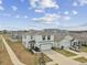 Aerial view of the home, showing the surrounding neighborhood, well-maintained lawn, and driveway at 7380 Sail Clover Ln, Zephyrhills, FL 33540