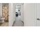 Hallway view leading to a bathroom and bedroom, highlighting the home's layout at 7380 Sail Clover Ln, Zephyrhills, FL 33540