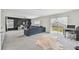 Open living space with plush sofa and sliding glass doors leading to the backyard at 7380 Sail Clover Ln, Zephyrhills, FL 33540