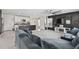 Modern living area with open floor plan, seamlessly connected to the updated kitchen at 7380 Sail Clover Ln, Zephyrhills, FL 33540