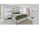 Well-lit main bedroom with a plush velvet bed, side tables, and comfortable decor at 7380 Sail Clover Ln, Zephyrhills, FL 33540