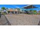 Playground area featuring swings, slides, and a clubhouse in the background, perfect for families at 7380 Sail Clover Ln, Zephyrhills, FL 33540