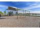 Community playground with swings, slides, and climbing structures by the lake at 7380 Sail Clover Ln, Zephyrhills, FL 33540
