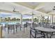 Covered seating area offering views of the pool and lake, perfect for relaxing at 7380 Sail Clover Ln, Zephyrhills, FL 33540
