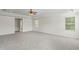 Bright, spacious carpeted bedroom with a ceiling fan and abundant natural light at 7412 Bridgeview Dr, Wesley Chapel, FL 33545