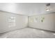 Spacious bedroom with plush carpeting, ample natural light, and fresh neutral paint at 7412 Bridgeview Dr, Wesley Chapel, FL 33545